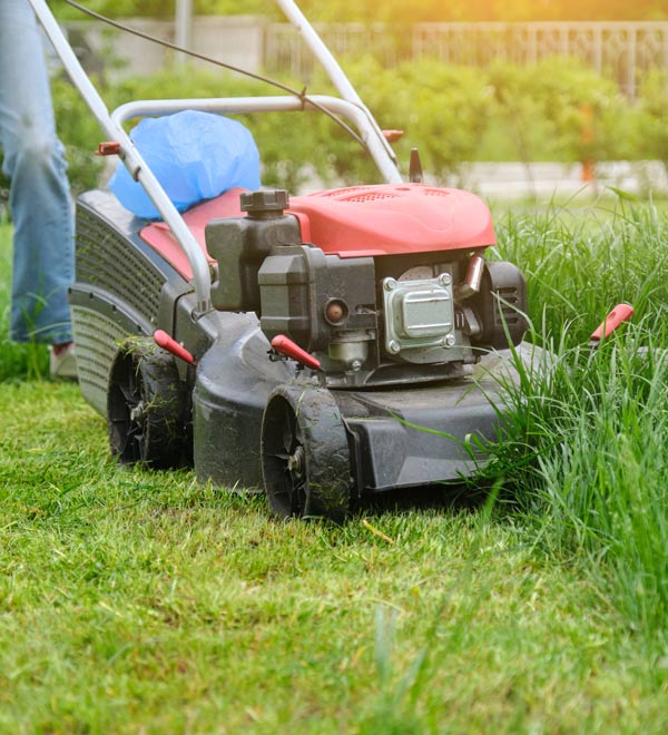 man mows the grass