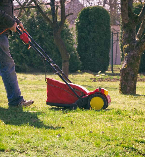 man mows the grass